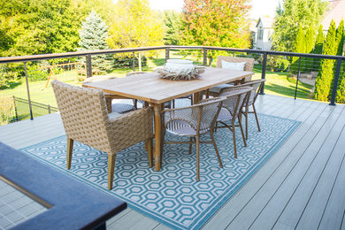 Deck - large traditional backyard deck idea in Other