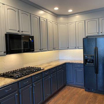 Refinished two-tone kitchen cabinets