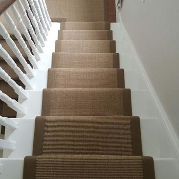 Brown Carpet with Brown Edgings Installed to Stairs