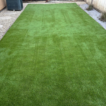 Artificial Grass with Paver Walkway and River Rock