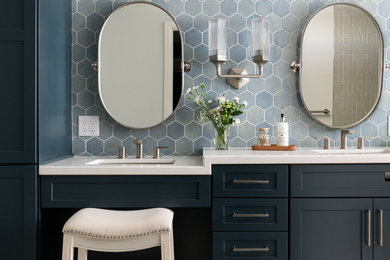 Example of a transitional master blue tile and ceramic tile porcelain tile, beige floor and double-sink bathroom design in Orange County with shaker cabinets, blue cabinets, white walls, an undermount sink, soapstone countertops, white countertops and a built-in vanity