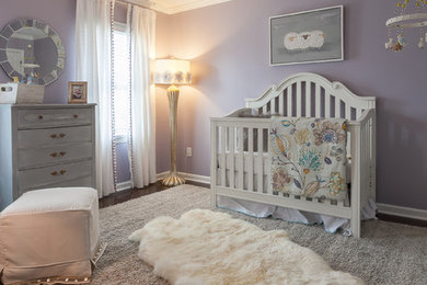 Example of a mid-sized transitional girl carpeted nursery design in Charleston with purple walls