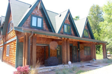 Inspiration for a mid-sized rustic two-story wood gable roof remodel in Milwaukee