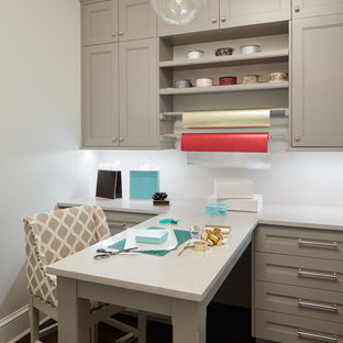 Inspiration for a transitional craft room in Chicago with dark hardwood floors and a built-in desk.