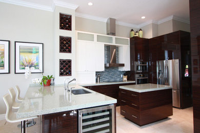 Kitchen - contemporary u-shaped porcelain tile and beige floor kitchen idea in Miami with a single-bowl sink, flat-panel cabinets, dark wood cabinets, quartzite countertops, multicolored backsplash, matchstick tile backsplash, stainless steel appliances and a peninsula
