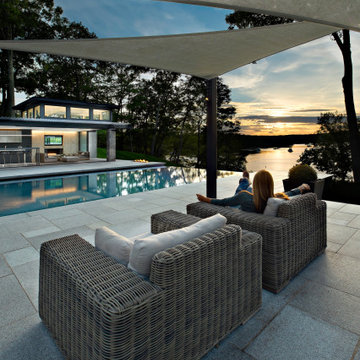 Waterfront Stone Modern Home and Pool House