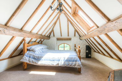 This is an example of a country bedroom in West Midlands.