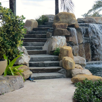 Stone staircase and pool waterfall