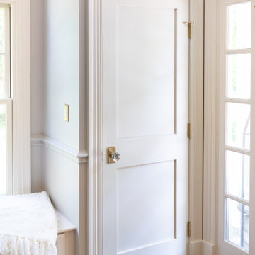 Welcoming Foyer with Custom Millwork and Natural Light