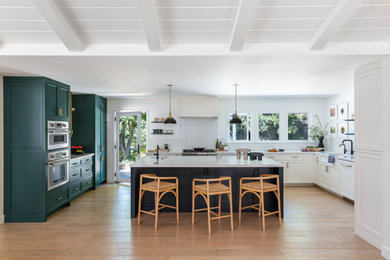 Transitional kitchen photo in San Francisco with shaker cabinets and an island