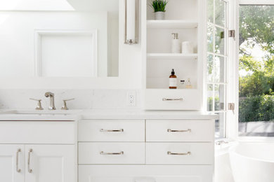 Large trendy master gray tile and porcelain tile white floor and porcelain tile bathroom photo in Portland with white walls, white countertops, shaker cabinets, white cabinets, an undermount sink, quartz countertops and a hinged shower door