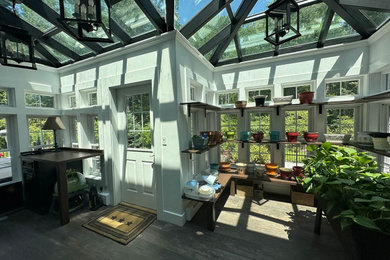 Large elegant gray floor sunroom photo in Boston with a glass ceiling