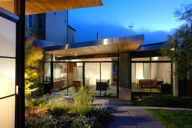 Example of a large minimalist gray three-story mixed siding exterior home design in San Francisco with a shed roof