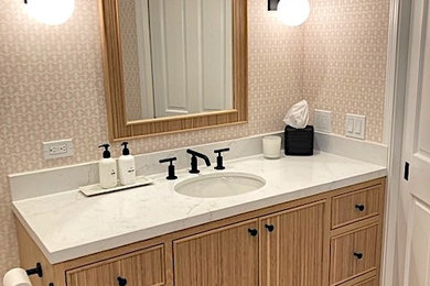 Small transitional kids' wood-look tile floor, vaulted ceiling and wallpaper bathroom photo in Santa Barbara with an undermount tub, pink walls, an undermount sink and a built-in vanity