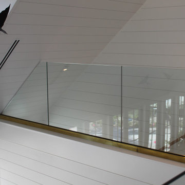 Glass Balustrade with Aluminum Base Rail Finished with Satin Brass Cladding