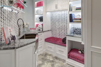Transitional laundry room in New York.