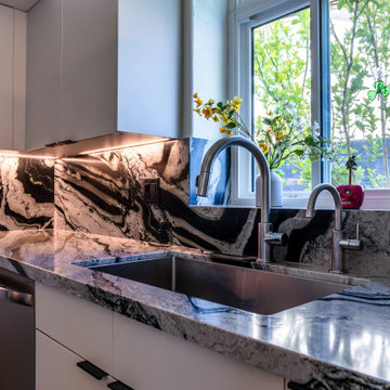 Matte Ivory Kitchen Remodel with Leathered Granite in Ahwautukee, AZ