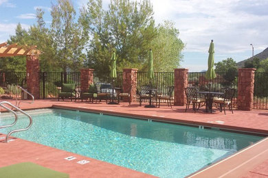 Mid-sized elegant backyard concrete and rectangular lap hot tub photo in Phoenix