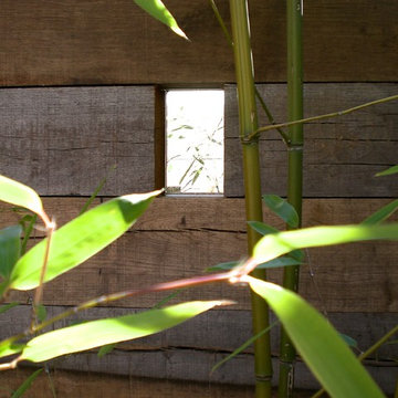 small courtyard space, wooden partition wall