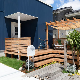 他の地域のアジアンスタイルのおしゃれなデッキ (パーゴラ) の写真