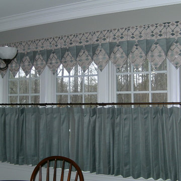 Turquois cafe curtains with complimentary valances