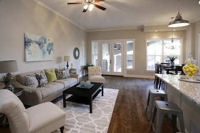 This is an example of a transitional family room in Houston.