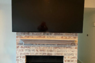 Tv mounting on stone fireplace