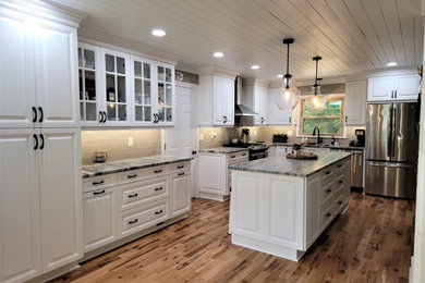 Eat-in kitchen - large rustic l-shaped medium tone wood floor, brown floor and shiplap ceiling eat-in kitchen idea in Richmond with an undermount sink, raised-panel cabinets, white cabinets, quartzite countertops, beige backsplash, porcelain backsplash, stainless steel appliances, an island and gray countertops