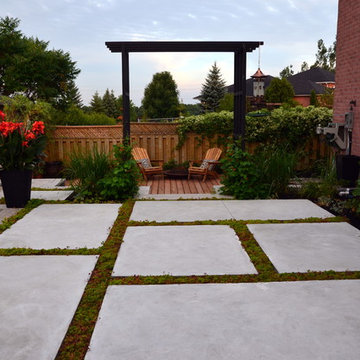 Modern Landscape with Fiberglass Pool, slab patio, water feature and more!