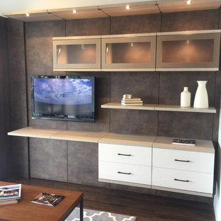 Home theater - mid-sized contemporary enclosed dark wood floor home theater idea in Jacksonville with gray walls and a wall-mounted tv