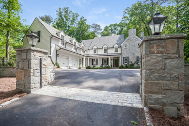 Example of a large classic white two-story wood gable roof design in Atlanta
