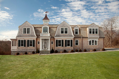 Large coastal wood exterior home idea in Providence