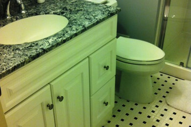 Inspiration for a small timeless master white tile and ceramic tile ceramic tile alcove shower remodel in Baltimore with an integrated sink, raised-panel cabinets, white cabinets, marble countertops, a two-piece toilet and gray walls