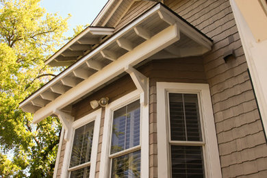Example of a large arts and crafts beige three-story concrete fiberboard exterior home design in Jacksonville