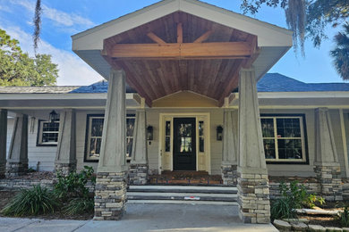 Covered Entry with Timber Ceiling and Stone Columns