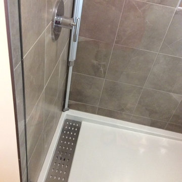 Enlarge bathroom, convert bedroom closet into bathroom shower. Full remodel.