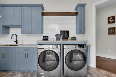 Example of a beach style laundry room design in Jacksonville