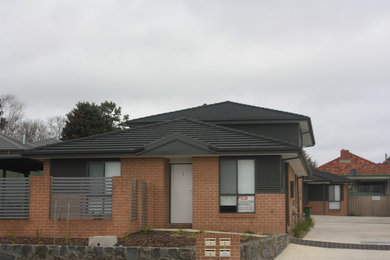 Modern two-storey townhouse exterior in Canberra - Queanbeyan with a tile roof.