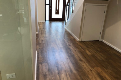 Design ideas for a country hallway in Newcastle - Maitland with vinyl floors and brown floor.