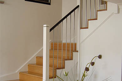 Design ideas for a modern wood l-shaped staircase in Sydney with wood risers.