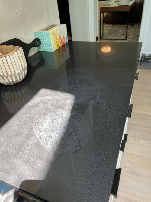 help! need advice regarding discoloration on black quartz countertops