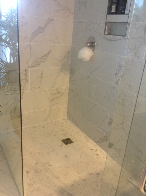 Curbless Shower floor has small pools of water