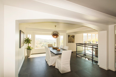 Inspiration for a mid-sized modern ceramic tile and black floor kitchen/dining room combo remodel in Los Angeles with white walls and no fireplace