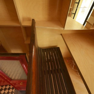 Inspiration for a small modern study in Paris with beige walls, ceramic flooring, no fireplace, a built-in desk and blue floors.