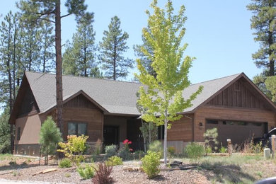 Example of a brown wood exterior home design in Albuquerque
