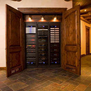 Large rustic open plan home cinema in Seattle with beige walls, slate flooring and a projector screen.