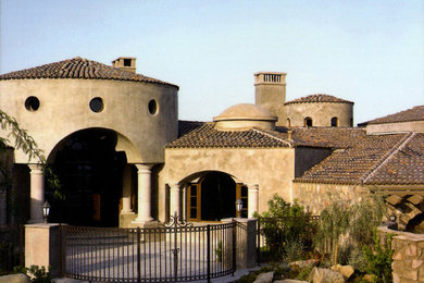 Example of a tuscan exterior home design in Phoenix