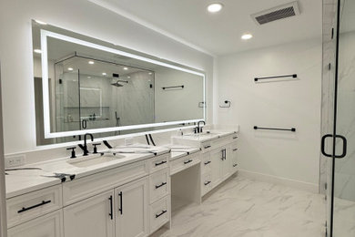 Mid-sized minimalist master white tile and porcelain tile porcelain tile, white floor and double-sink walk-in shower photo in Tampa with shaker cabinets, white cabinets, a bidet, white walls, an undermount sink, quartz countertops, a hinged shower door, white countertops, a niche and a built-in vanity