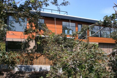 Large trendy three-story exterior home photo in Vancouver