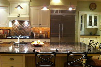 Eat-in kitchen - large transitional l-shaped eat-in kitchen idea in Boston with raised-panel cabinets, white cabinets, granite countertops, metallic backsplash, terra-cotta backsplash, stainless steel appliances and an island